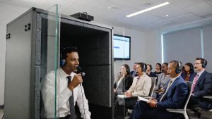conference interpreter Nepal providing real-time interpretation at a US corporate conference