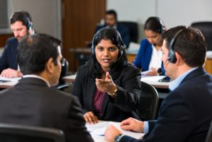 Tamil legal interpreter assisting in Defense Base Act case communication